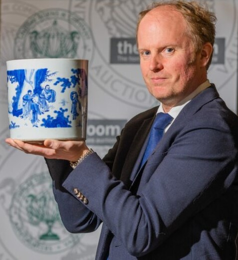 A Chinese blue & white porcelain brush pot sells at auction for £51,000